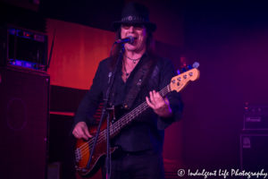 Chuck Wright of Quiet Riot live on bass guitar at Kanza Hall in Overland Park, Kansas on December 10, 2016, Kansas City concert photography.