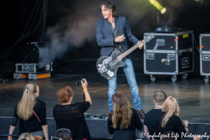 Rick Springfield flicking a guitar pick at Starlight Theatre May 5, 2017, Kansas City concert photography.