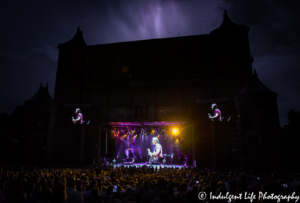 Jonathan Cain moving from keyboards to guitar for "Only the Young" (1985) just before the storm shut down the concert at Starlight Theatre in Kansas City, MO on July 22, 2017.