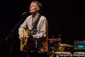 Steve Winwood playing the acoustic guitar at Uptown Theater in Kansas City, MO on March 2, 2018.