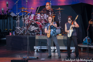 Lead singer Tom Johnston and guitarist John McFee with drummer Ed Toth of The Doobie Brothers live in concert at Starlight Theatre in Kansas City, MO on June 18, 2018.