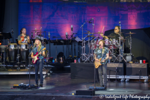 Frontman Tom Johnston and guitarist Patrick Simmons with drummer Ed Toth and percussionist Marc Quiñones of The Doobie Brothers live at Starlight Theatre in Kansas City, MO on June 18, 2018.