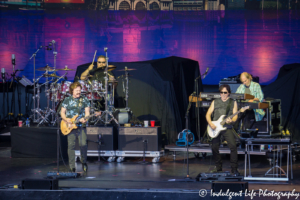 Frontman Tom Johnston and guitarist John McFee with drummer Ed Toth and keyboard player Bill Payne of The Doobie Brothers live at Starlight Theatre in Kansas City, MO on June 18, 2018.