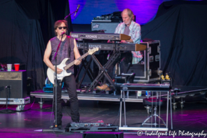 Guitarist John McFee with keyboard player Bill Payne of The Doobie Brothers live at Starlight Theatre in Kansas City, MO on June 18, 2018.