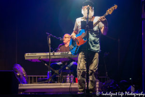 Bass player Paul Gregg with keyboardist Dave Innis of Restless Heart performing live at Festival on the Trails in Gardner, KS on June 9, 2018.