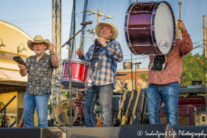 Ricochet members performing a drumline with Heath Wright on snare drum, Shane Mullins on bass drum and Larry Hight on cowbell at Festival on the Trails in Gardner, KS on June 9, 2018.