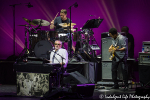 Steely Dan lead singer Donald Fagen performing live with bass player Freddie Washington and drummer Keith Carlock at Starlight Theatre in Kansas City, MO on June 18, 2018.