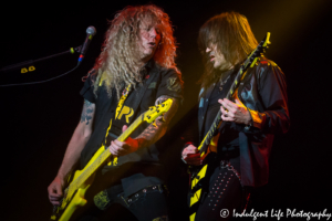 Bassist Perry Richardson with frontman and guitarist Michael Sweet of Christian metal band Stryper live in concert at Star Pavilion inside of Ameristar Casino in Kansas City, MO on May 25, 2018.