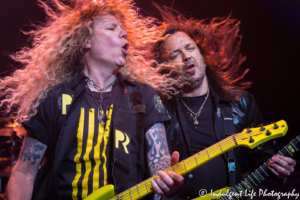 Bass player Perry Richardson with lead singer and guitarist Michael Sweet of Christian metal band Stryper performing live at Star Pavilion inside of Ameristar Casino Hotel Kansas City on May 25, 2018.