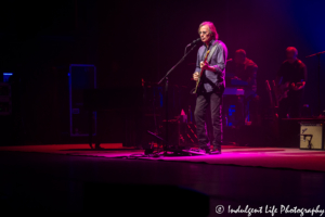 Jackson Browne performing live with bass guitar player Bob Glaub and keyboardist Jeff Young at Kansas City Music Hall on June 24, 2018.