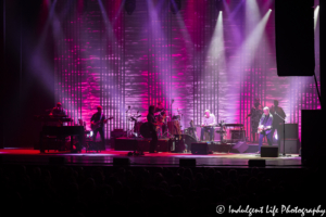 Jackson Browne and band with spotlight on guitarist Shane Fontayne and steel guitar player Greg Leisz live at Music Hall in Kansas City, MO on June 24, 2018.