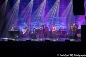 Jackson Browne playing the piano with his 7-member backing band live at Kansas City Music Hall on June 24, 2018.