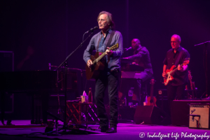 Folk rock icon Jackson Browne performing live with keyboardist Jeff Young and bass guitar player Bob Glaub at Kansas City Music Hall on June 24, 2018.