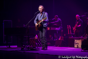 Jackson Browne live in concert with keyboard player Jeff Young and bass guitarist Bob Glaub at Music Hall in Kansas City, MO on June 24, 2018.