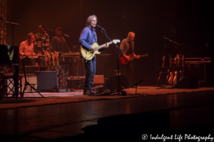 Jackson Browne performing live at Kansas City Music Hall with guitarist Shane Fontayne, steel guitarist Greg Leisz and vocalists Alethea Mills and Chavonne Stewart on June 24, 2018.