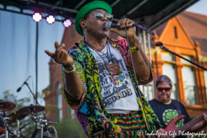 Frontman Ras Neville performing live with bass player Kenny Jahn of The Kingstonians at Live on Mass in downtown Lawrence, KS on June 29, 2018.