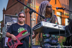 Bass player Kenny Jahn and keyboardist Edward Turner of Ras Neville & The Kingstonians performing Live on Mass in downtown Lawrence, KS on June 29, 2018