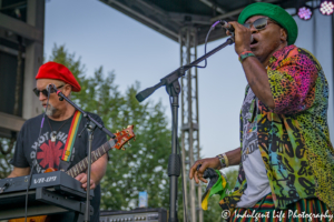 Ras Neville and keyboard player Scotty Wenzel performing Live on Mass in downtown Lawrence, KS on June 29, 2018.