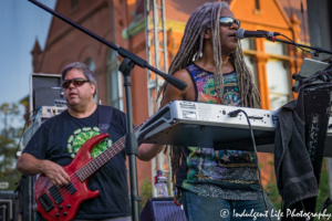 Keyboard player Edward Turner and bass guitarist Kenny Jahn of Ras Neville & The Kingstonians in concert at the Live on Mass event in Lawrence, KS on June 29, 2018.