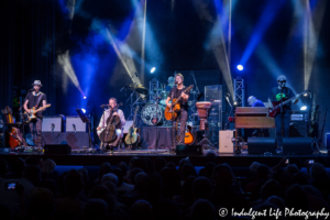 Michael Bacon live in concert on the cello with The Bacon Brothers band at VooDoo Lounge in Harrah's Casino in Kansas City, MO on July 14, 2018.