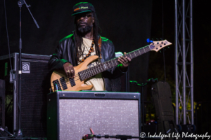 The Wailers bass guitar player Aston "Familyman" Barrett performing Live on Mass in downtown Lawrence, KS on June 29, 2018.