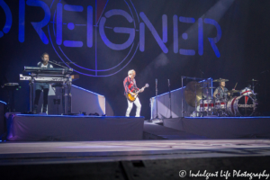 Foreigner founding member Mick Jones opening the Juke Box Hero tour stop with keyboardist Michael Bluestein and drummer Chris Frazier at Starlight Theatre in Kansas City, MO on July 17, 2018.