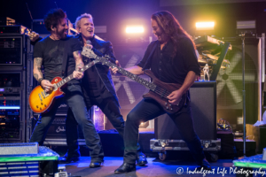 Billy Idol performing live with band members Paul Trudeau and Stephen McGrath at Uptown Theater in Kansas City, MO on September 21, 2018.