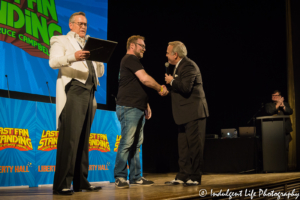 Last Fan Standing trivia show winner receiving his splaque for winning the entire show at Liberty Hall in Lawrence, KS on November 15, 2018.