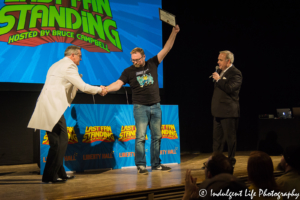 Last Fan Trivia winner happily accepting his diploma for winning at Liberty Hall in Lawrence, KS on November 15, 2018.