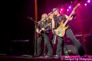 Great White lead singer Mitch Malloy with guitarist Michael Lardie and bass player Scott Snyder in concert at Star Pavilion inside Ameristar Casino in Kansas City, MO on May 24, 2019.