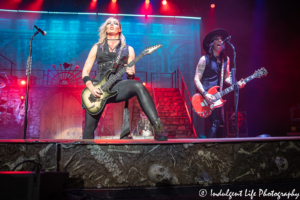 Alice Cooper band guitarists Nita Strauss and Tommy Henriksen live in concert at Kansas City's Starlight Theatre on July 26, 2019.