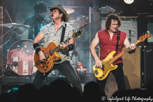 Ted Nugent performing live in concert with bandmates Greg Smith and Gary Hartless at Ameristar Casino in Kansas City, MO on August 2, 2019.