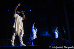 R&B trio Boyz II Men singing harmonies live inside Kauffman Center's Muriel Kauffman Theatre in downtown Kansas City, MO on October 2, 2019.