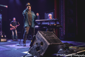 Toto lead vocalist Joseph Williams performing with keyboard player Steve Porcaro and saxophonist Warren Ham at Uptown Theater in Kansas City, MO on September 27, 2019.