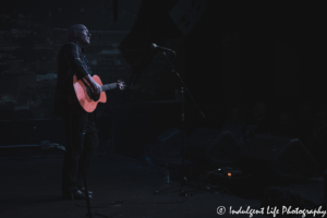 Former Ultravox frontman Midge Ure playing the acoustic guitar at the recordBar in downtown Kansas City, MO on January 27, 2020.