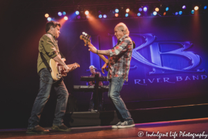 LRB keyboard player Chris Marion looks on as frontman Wayne Nelson and guitarist Rich Herring jam together at Ameristar Casino in Kansas City, MO on January 15, 2022.