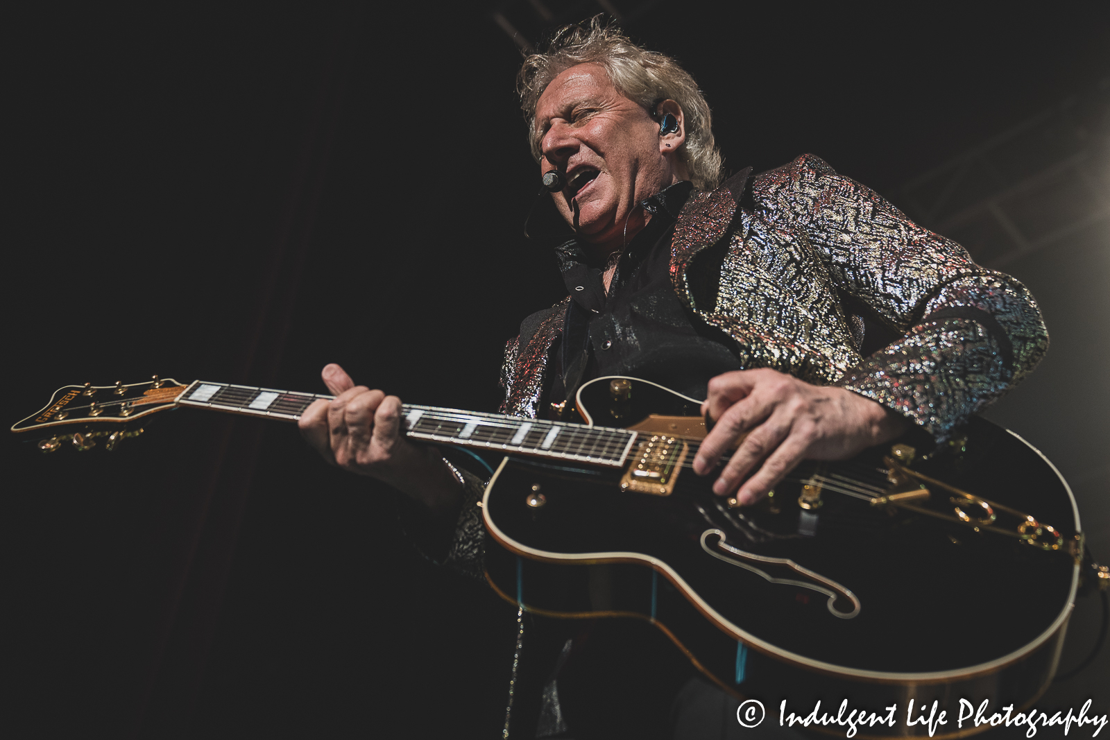 Graham Russell of Air Supply singing and playing the guitar at Ameristar Casino's Star Pavilion in Kansas City, MO on May 7, 2022.