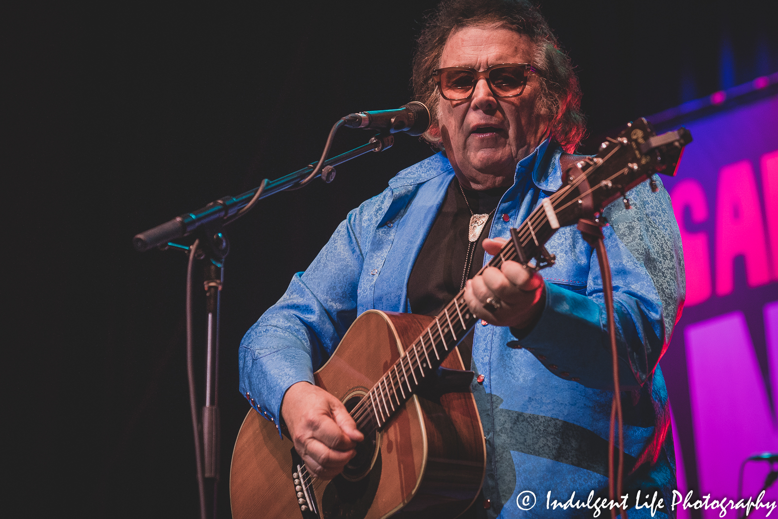 Don McLean playing the acoustic guitar during his concert at Uptown Theater in Kansas City, MO on April 29, 2022.