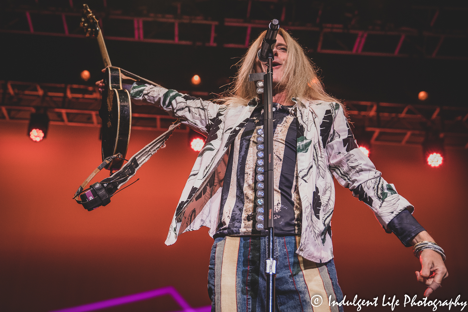 Lead vocalist Derek Sharp of The Guess Who handing off his guitar to the tech at Ameristar Casino in Kansas City, MO on September 9, 2022.