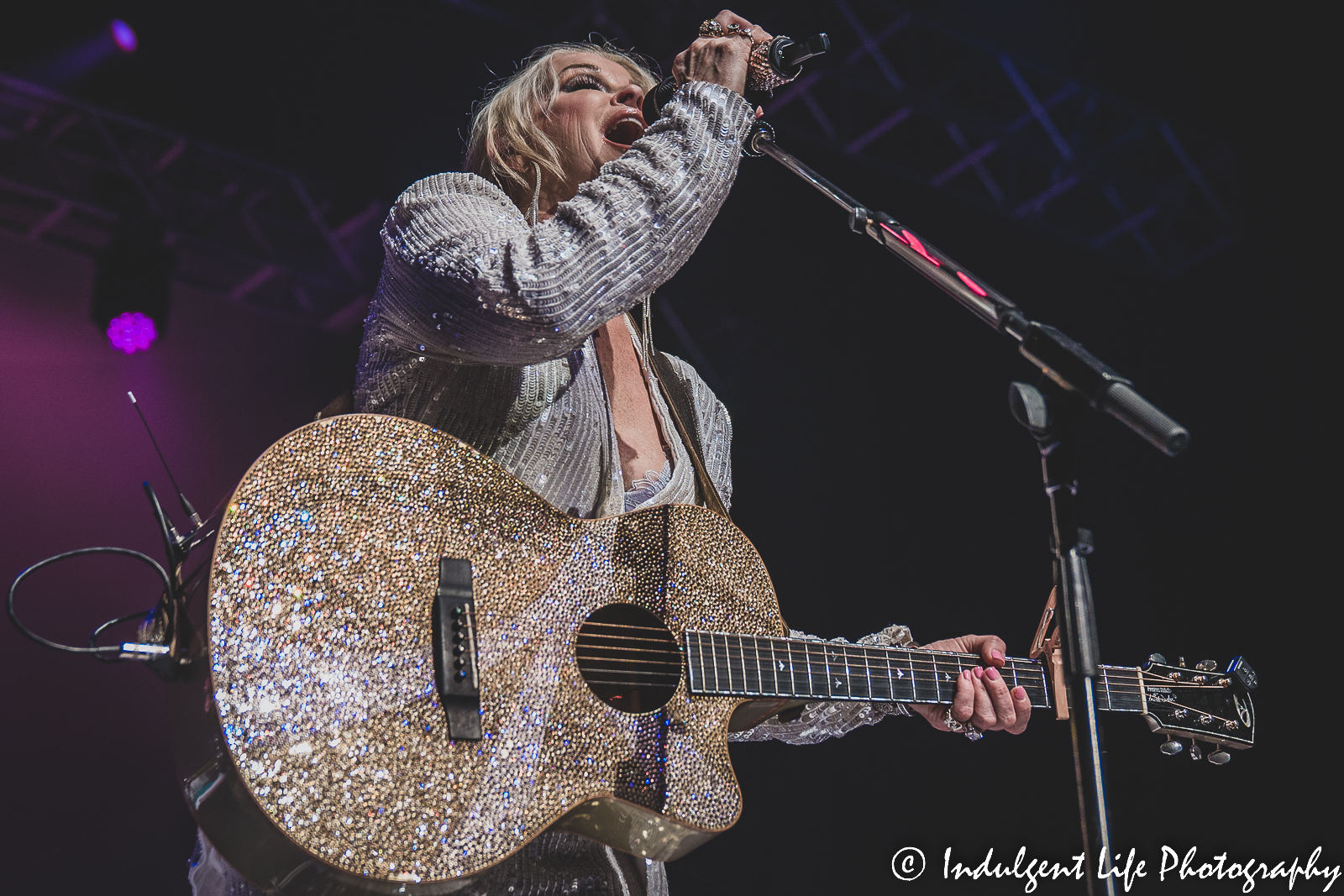 Lorrie Morgan singing "Out of Your Shoes" during her performance at Ameristar Casino Hotel Kansas City on January 21, 2023.