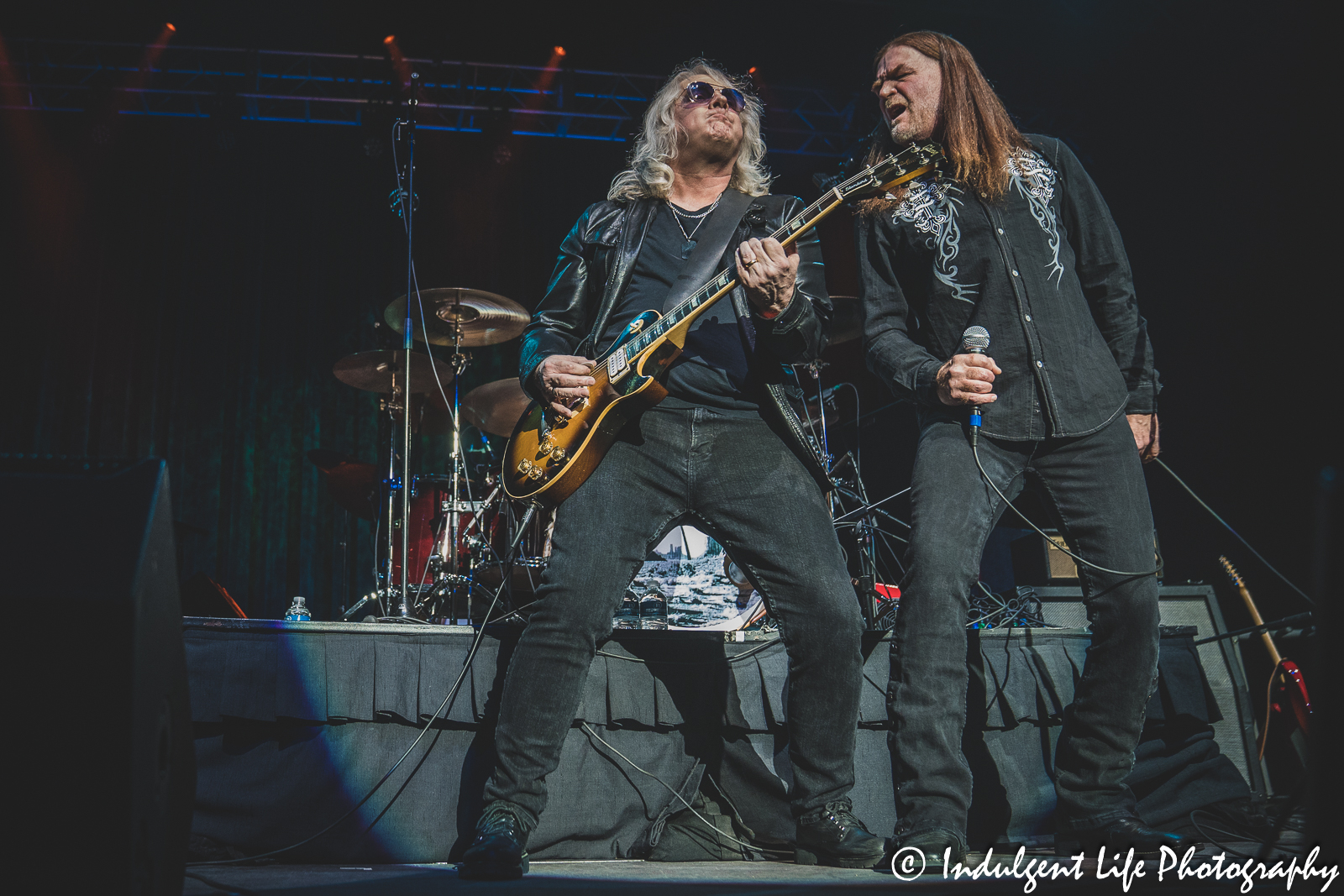 Guitarist Rusty Crewse and lead singer Frank Drummond in concert together at Ameristar Casino Hotel Kansas City on March 18, 2023.