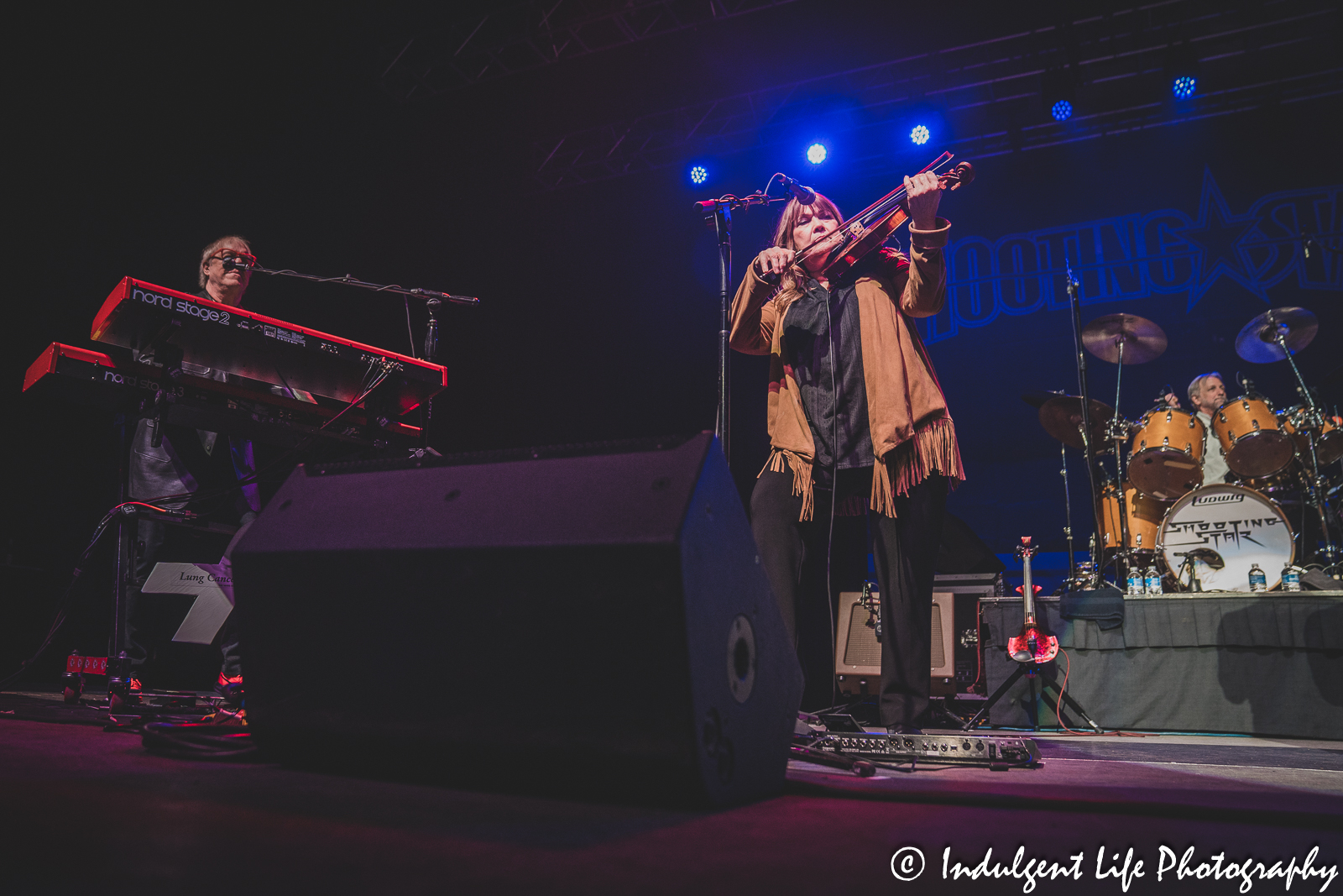 Shooting Star keyboardist Dennis Laffoon, violin player Janet Jameson and drummer Steve Thomas live in concert at Ameristar Casino in Kansas City, MO on March 18, 2023.