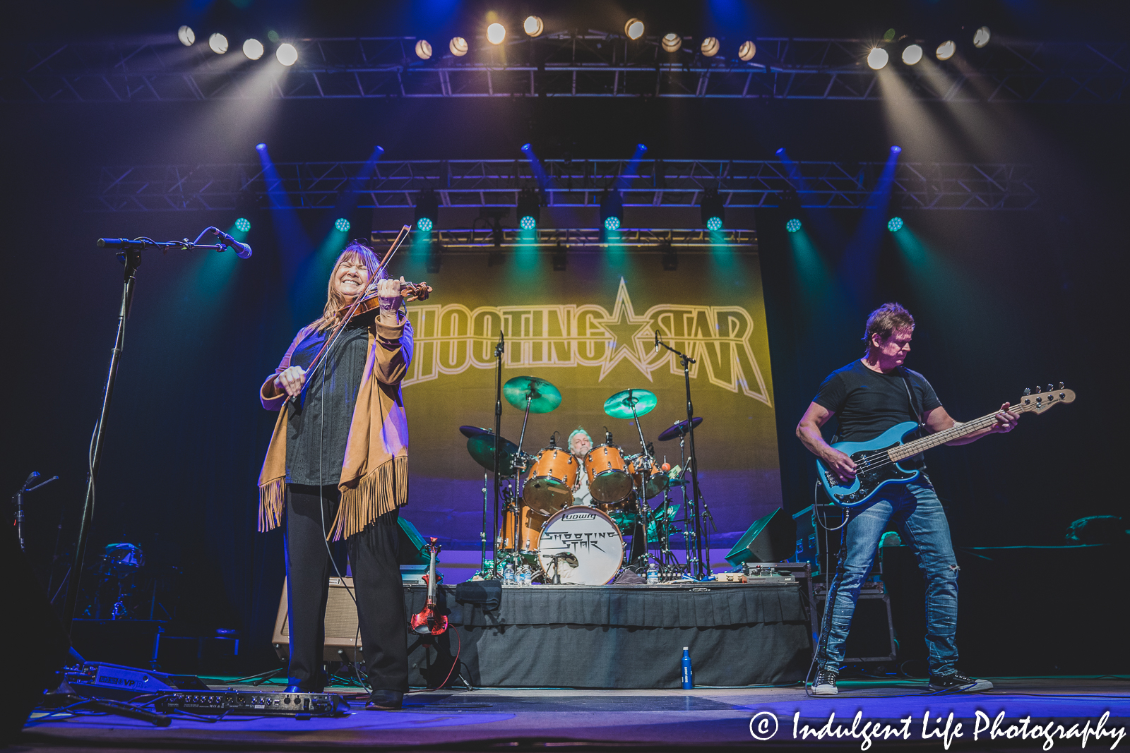 Violin player Janet Jameson of Shooting Star performing with frontman Todd Pettygrove and drummer Steve Thomas as Ameristar Casino in Kansas City, MO on March 18, 2023.