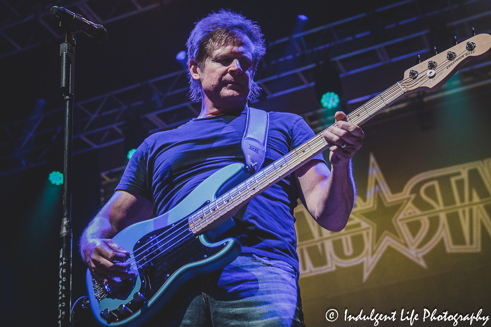 Shooting Star frontman Todd Pettygrove playing the bass guitar live at Ameristar Casino's Star Pavilion in Kansas City, MO on March 18, 2023.