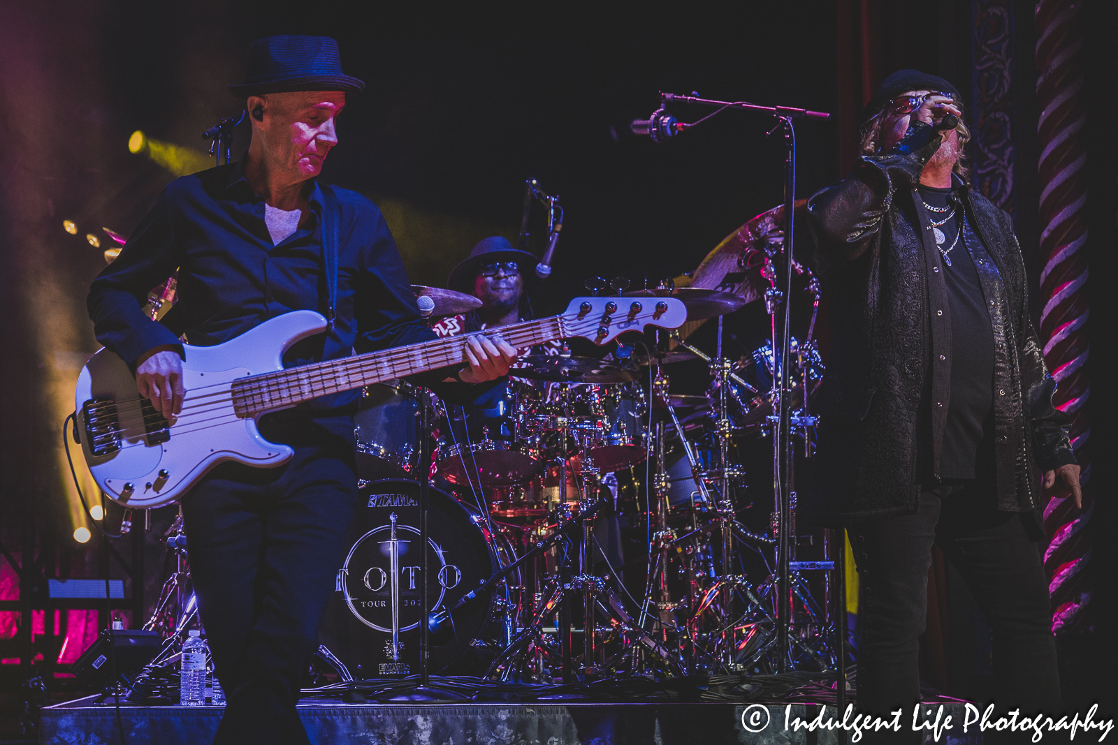 Toto bass player John Price performing with frontman Joseph Williams and drummer Robert “Sput” Searight at Uptown Theater in Kansas City, MO on March 29, 2023.