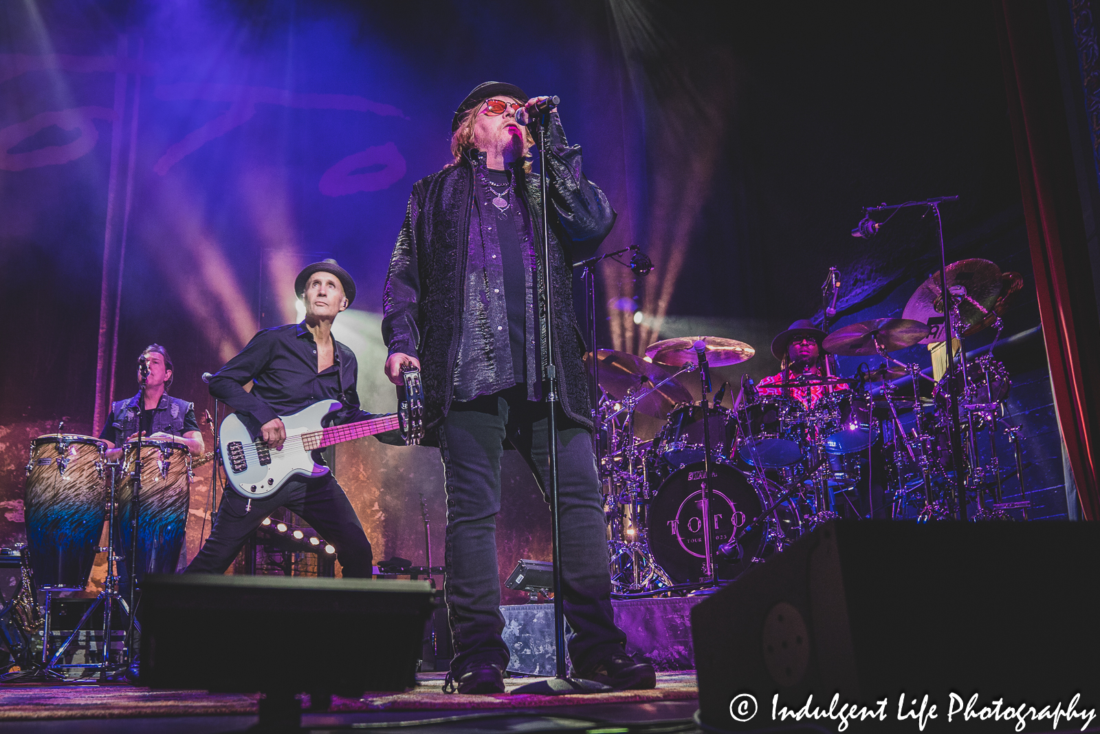 Toto lead singer Joseph Williams performing with bass drummer Robert “Sput” Searight, bass guitarist John Price and multi-instrumentalist Warren Ham at Uptown Theater in Kansas City, MO on March 29, 2023.