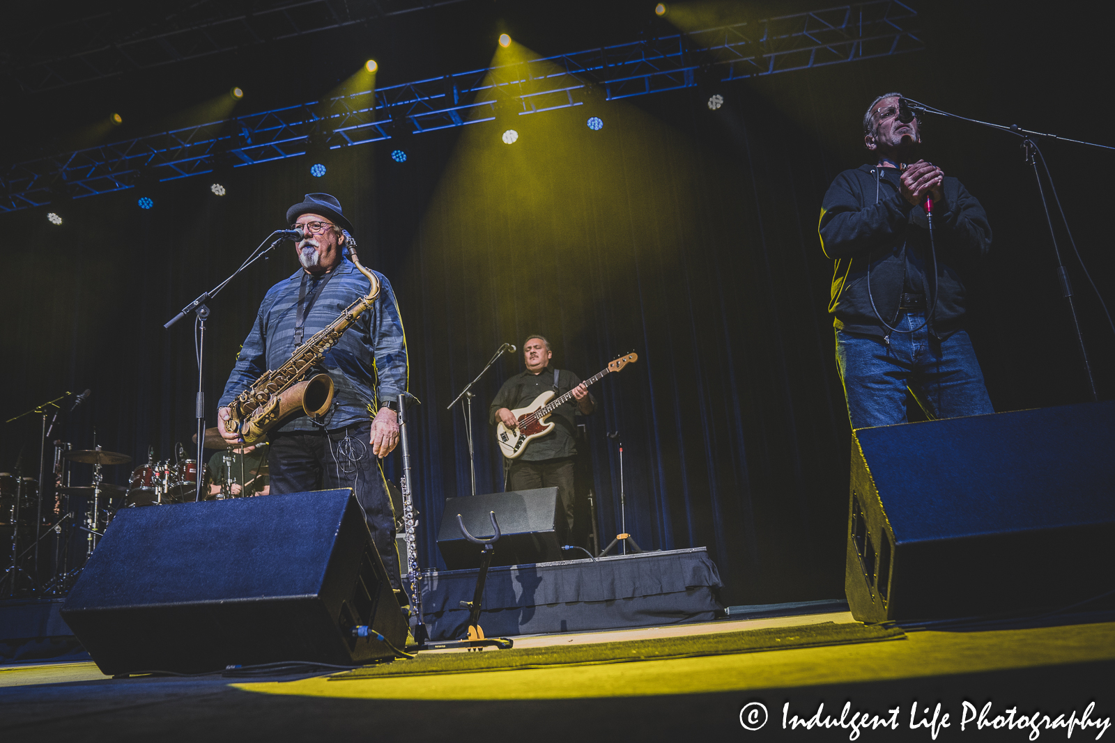 Saxophone player Scott Martin, bass guitarist Trevor Huxley and harmonica player Mitch Kashmar of rock band WAR at Star Pavilion inside of Ameristar Casino Hotel Kansas City on March 11, 2023.