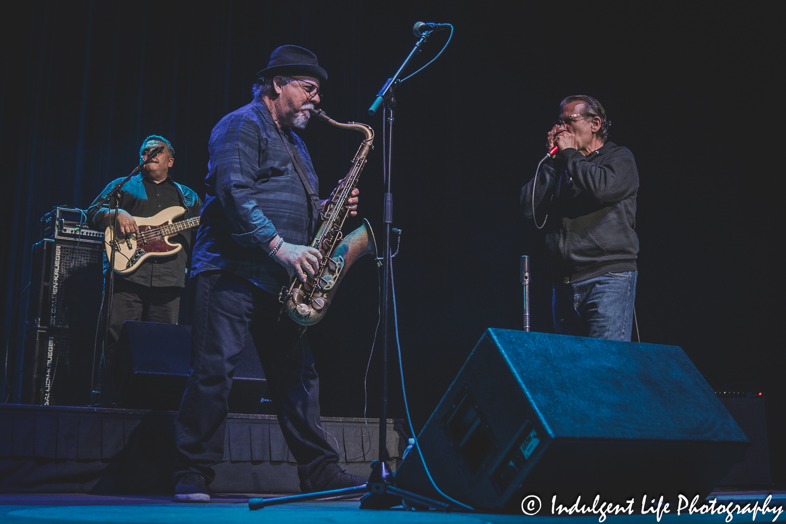 Saxophonist Scott Martin, bass player Trevor Huxley and harmonicist Mitch Kashmar of rock band WAR at Ameristar Casino's Star Pavilion in Kansas City on March 11, 2023.