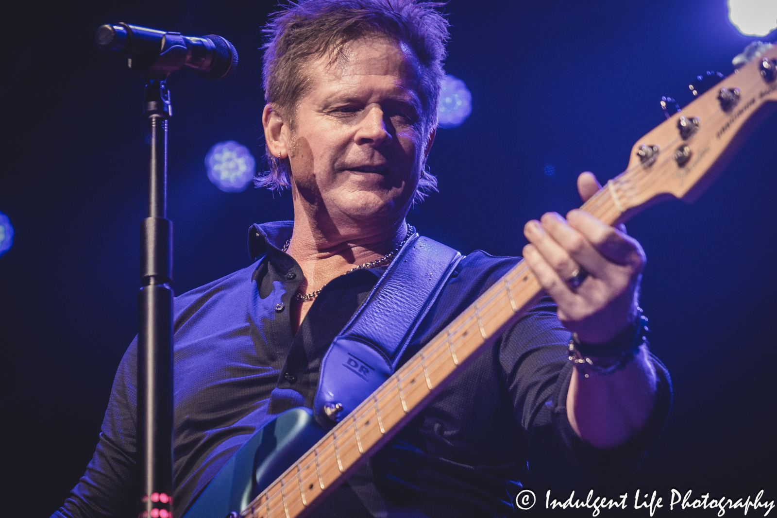 Shooting Star frontman Todd Pettygrove playing the bass guitar live at Ameristar Casino's Star Pavilion in Kansas City, MO on April 20, 2024.