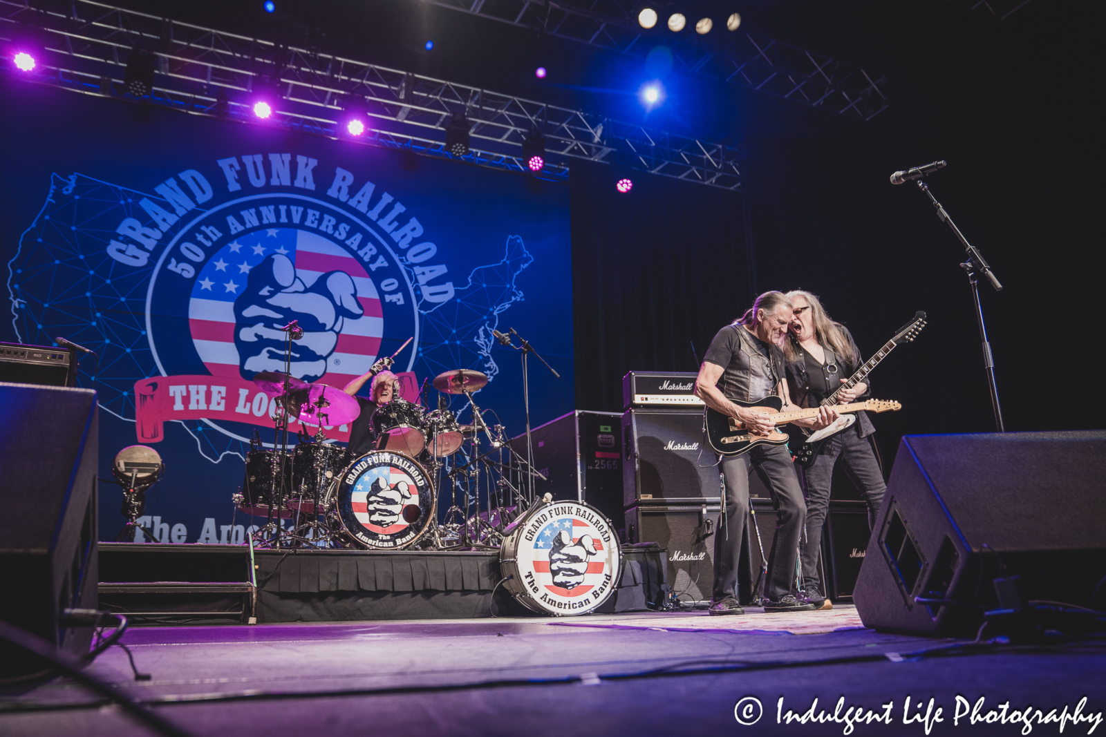 Grand Funk Railroad drummer Don Brewer, frontman Max Carl and guitarist Mark Chatfield performing together at Ameristar Casino in Kansas City, MO on June 21, 2024.